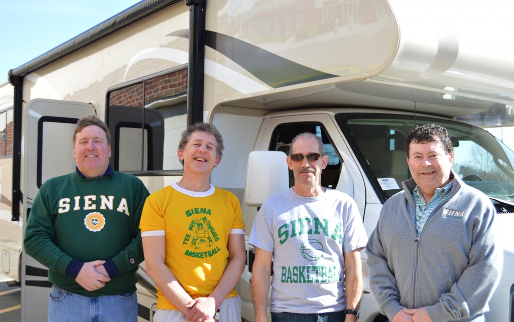 Siena College alumni Joe Altieri, Robert Folkl, Keith Perry, and Shane Somerville (left to right) prepare to board an Alpin Haus RV at Siena College in Loudonville, NY on Friday, February 24 to see the Siena men’s basketball team play Monmouth in New Jersey.