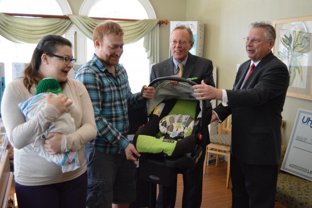 From right, UHY LLP Office Managing Partner – Capital Region Howard Foote; Ellis Medicine President and Chief Executive Officer Paul Milton; and new parents Steve Badala and Giana Mazzatta. The parents were provided the safety device to transport their newborn, Ruxin Salvatore Badala, who was recently born at Bellevue Woman’s Center.