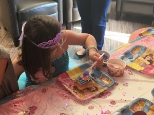 Central New York Wish Kid Lilianah Winship decorates her own star donut