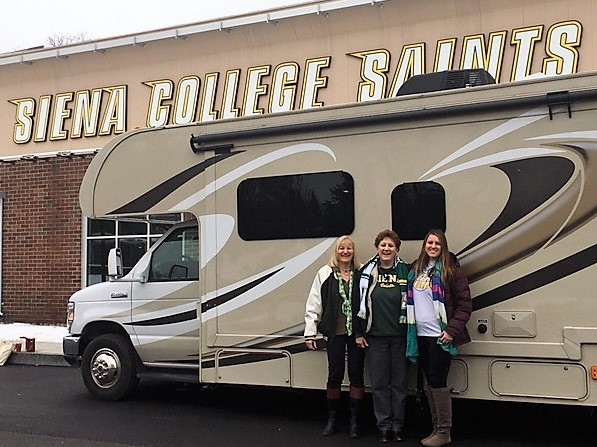 Troy resident Teresa Hughes (center), her sister Diana Bleau (left) and daughter Audrey Hughes (right), received roundtrip transportation aboard an Alpin Haus RV and tickets to the game in Hamden, Connecticut. 