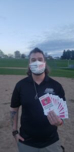 Alternative Baseball Organization Rochester Region General Manager Nate Gross holds gift cards that were donated by Dunkin’