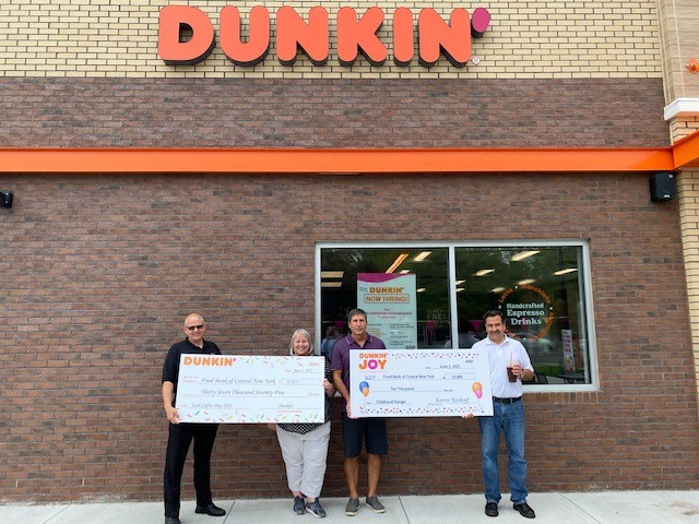 From left to right: Dunkin’ Field Marketing Manager Eric Stensland; Food Bank of Central New York Chief Development Officer Lynn Hy; Dunkin’ franchisee Tom Santurri; and The Wolak Group Chief of Staff Bob Alberti.