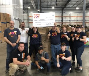 Dunkin’ and the Joy in Childhood Foundation celebrate 10 years of volunteering and supporting hunger relief by surprising Food Bank of Central New York with a $50,000 grant during their annual volunteer event. Dunkin’ franchisees and crew members teamed up with the Food Bank on Tuesday, April 9 to pack 230 boxes of food, equivalent to 4,792 meals.